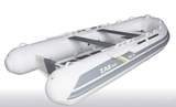 A white inflatable dinghy with gray side stripes and black interior seating, shown on a clean white background. The side of the boat reads 'ZAR mini' and 'RB 12'.