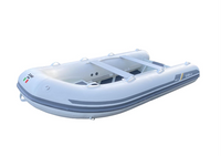 A white and gray inflatable dinghy boat with a rigid side wall, dual carrying straps, and a small Italian flag emblem on the side, shown against a plain white background.